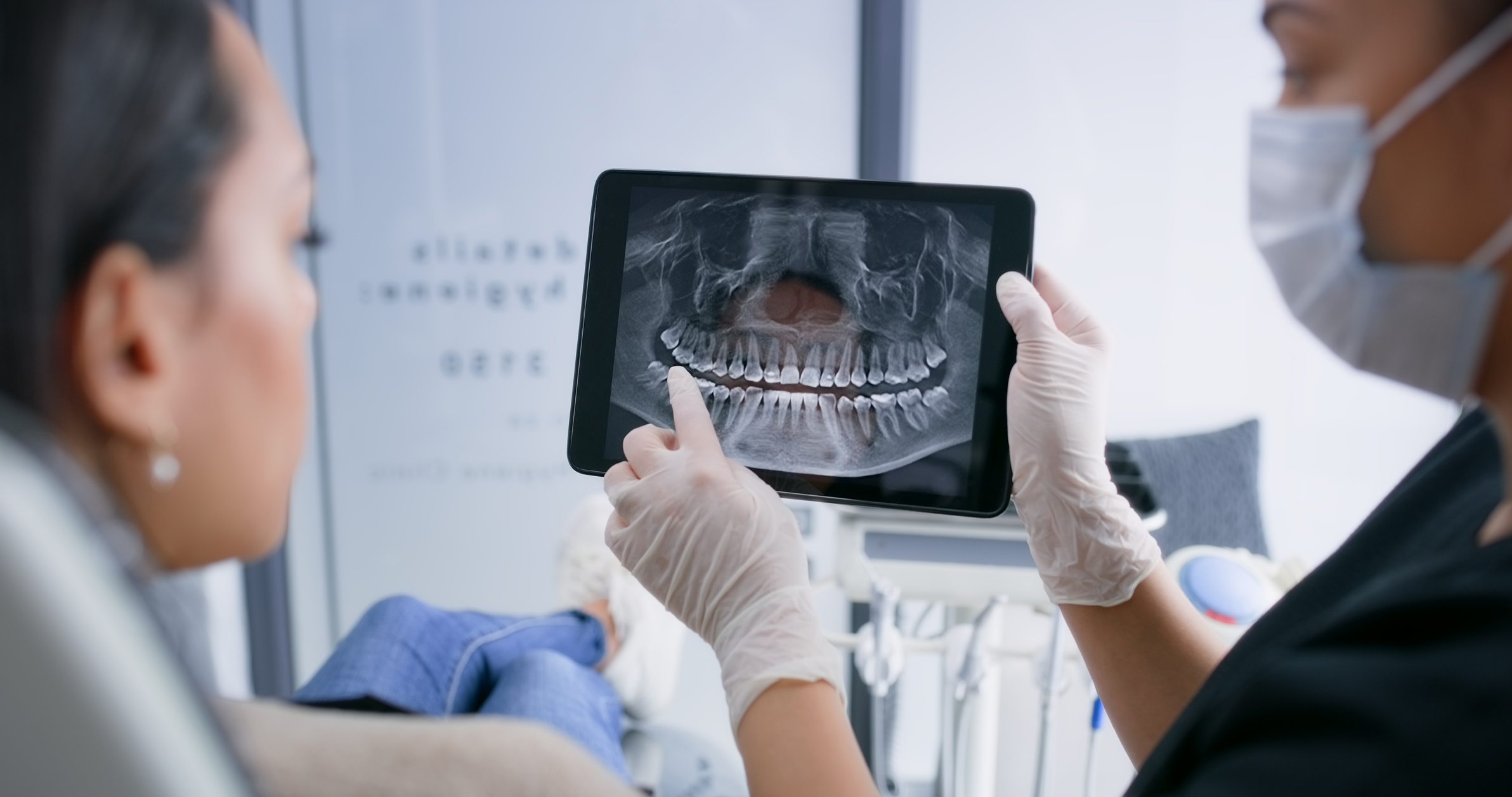 Hands, tablet and teeth xray, dentist and patient with dental surgery and health, people and orthodontics at clinic. Healthcare, wellness and digital scan of mouth on screen with cavity or gingivitis